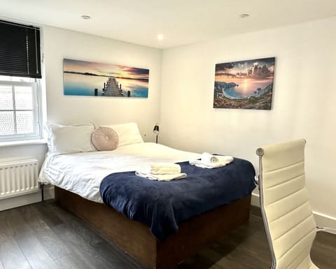 Beautiful large bedroom with stunning natural light, smart TV, desk with ergonomic chair, on-suite bathroom with walk in shower, lamp, built in wardrobe, chest of draws and everything else you need for a perfect stay! 