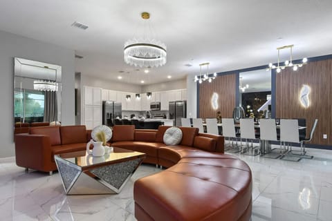 Seamless elegance: An expansive open-concept living, dining, and kitchen space designed for ultimate comfort and style