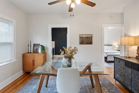 Dining table with seating for two and plenty of storage in the two sideboards.