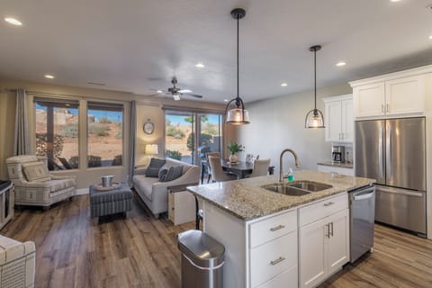 View from Kitchen Island - Designed as an open floor plan, the kitchen and living room area is a great gathering place for meals, games, or watching TV during your stay