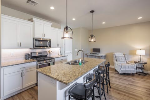 Kitchen - The kitchen is fully stocked with all the dishes, cookware, baking pans, and cutlery you will need for meal preparations and includes stainless steel appliances and granite counter tops.