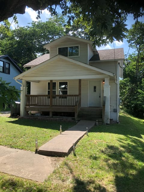 Front of house with porch.