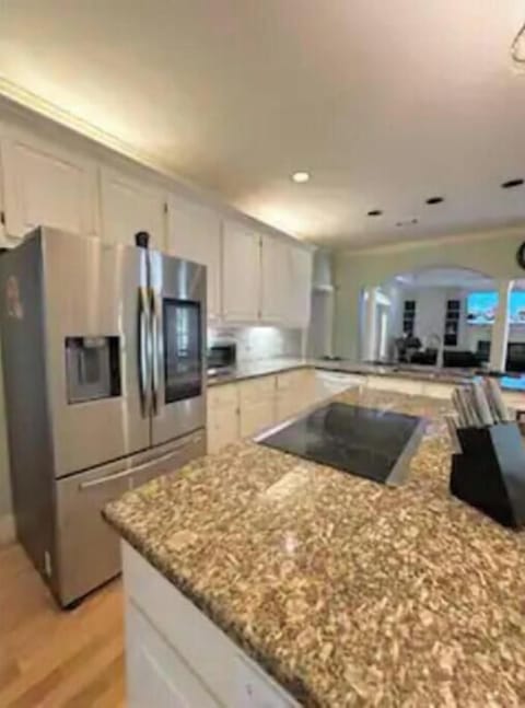 Gourmet kitchen open concept to eat n area and family TV area