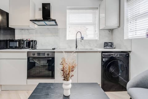 A compact, fully equipped kitchen with an induction hob, oven, microwave, fridge, toaster, and all the essentials you need to prepare simple meals during your stay — practical, convenient. No tea, coffee, or sugar is provided at this stage.