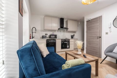 Lounge with sofa bed and kitchen