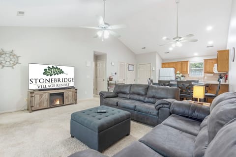 Living Area with Cable TV, Seasonal Fireplace, and Deck Access