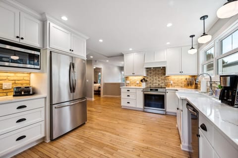 We have new, stainless appliances including an induction stove, dishwasher and refrigerator with ice maker.