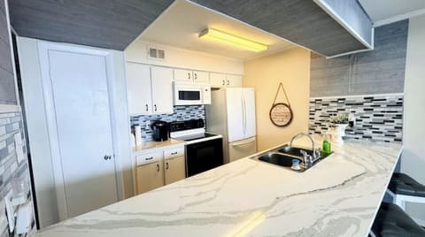 Kitchen comes equipped with all of the necessities. 