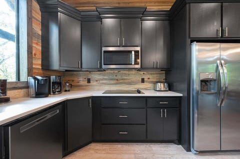 Stove top, microwave, dishwasher, and refrigerator/freezer