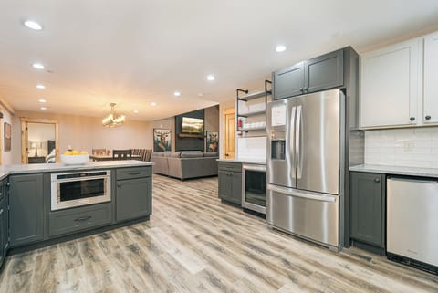 The kitchen also has a wine fridge, coffee maker/Keurig, and toaster.