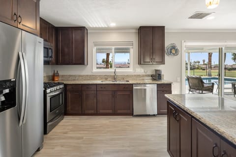 Stainless steel appliances and tons of cabinet space make cooking here a breeze.