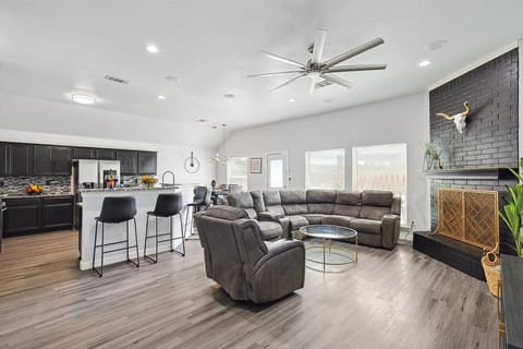 Spacious, open concept living room that opens up to the dining area and kitchen