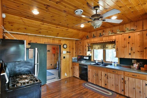 Aunt Alice's Kitchen has full size appliances and a knotty pine decor.