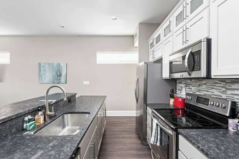 Join the designated group chef at the island and keep them company.