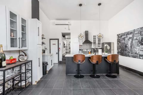 Kitchen space with bar seating and artistic accents