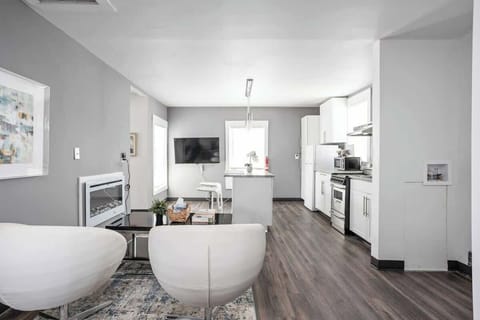 Our living room includes modern design, high-speed internet, and plush chairs!
