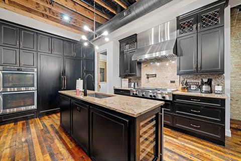 Polished kitchen view highlighting clean lines, rich finishes, and everyday functionality.