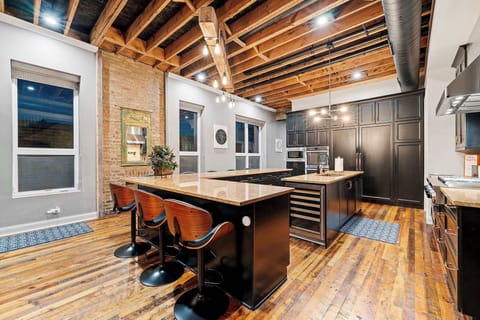 Spacious kitchen setup w/ island seating, perfect for casual meals and conversation.