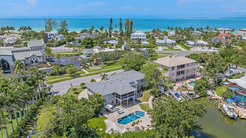 This stunning Sarasota vacation home offers the best of both worlds with a sparkling private pool, convenient canal access, and breathtaking proximity to the pristine Siesta Key beaches.