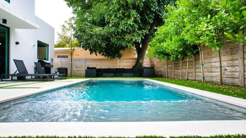  Private backyard with a modern swimming pool.