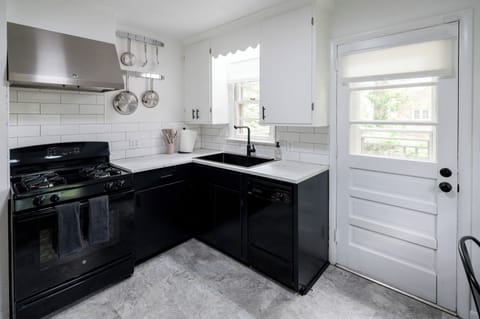 Fridge, gas range/oven, dishwasher, double-size sink, toaster, and microwave!