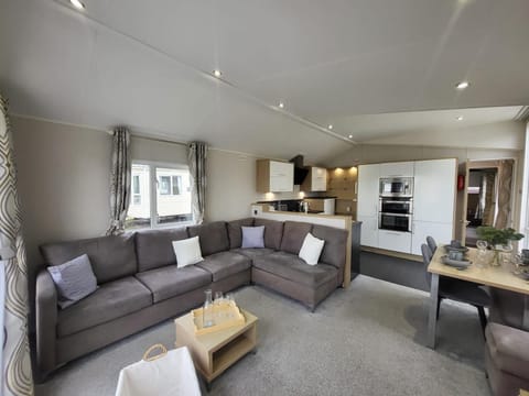 After exploring the Walton on the Naze tower, your family can relax in the comfortable living room of your caravan and enjoy a peaceful evening.