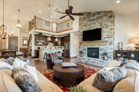 Main level living room with a gas fireplace and Smart TV