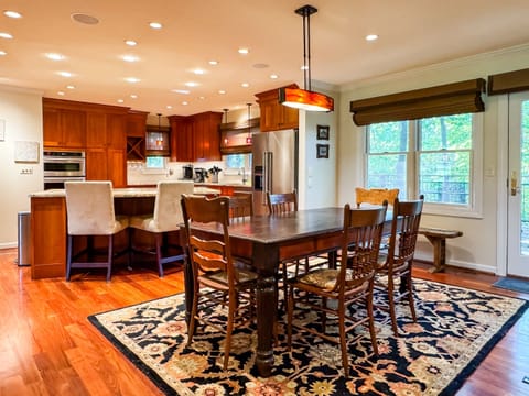 Gorgeous Kitchen and Dining table area made for families/groups to escape the busy days of life at Pointer Haus.