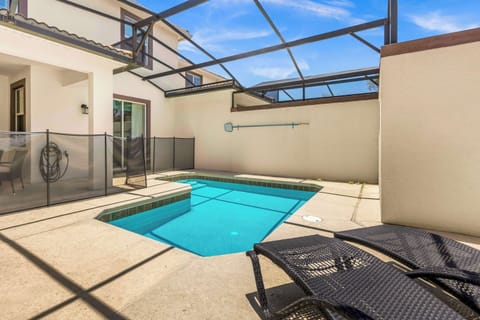 Relax by your private pool oasis, perfect for sunbathing and family fun in a secure setting.