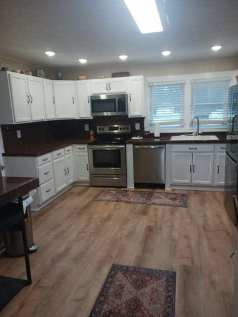 New kitcken with stainless appliances.. equipped for cooking and coffee bar