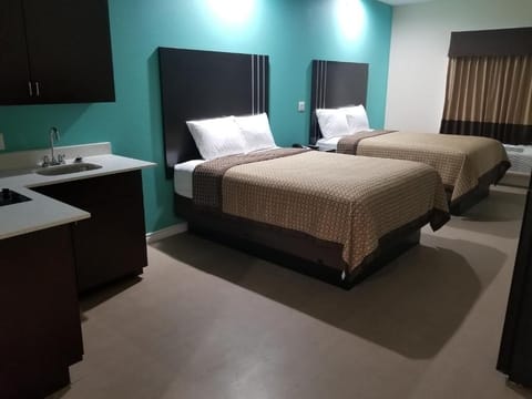 Unwind in a spacious double-room with handy kitchenette convenience.