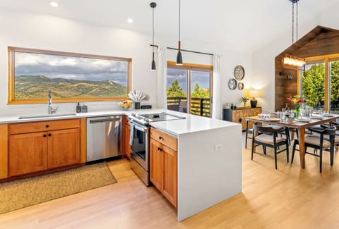 Cook like home with quartz counters, stainless appliances, air fryer & blender.