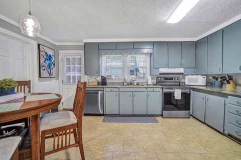 Bright kitchen with modern appliances and essentials.