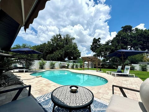 Gorgeous Backyard with Pool & Hot Tub (Not Pictured), Loungers, Umbrellas, and ample Seating