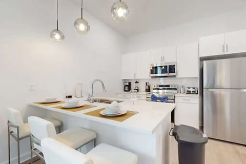 The kitchen featured gleaming stainless steel appliances, ample counter space, and a charming breakfast nook bathed in the morning sunlight.