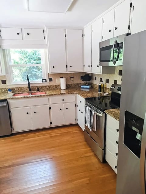 The kitchen boasts stainless steel appliances