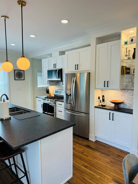 Fully equipped kitchen with an island seating four