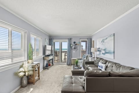 The ocean front living room is well-appointed with comfortable furnishings.