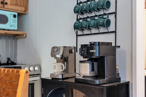 fully stocked kitchen with dishwasher, coffee bar, and all the essentials