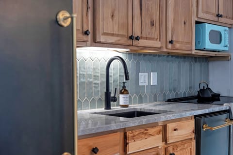 fully stocked kitchen with dishwasher, coffee bar, and all the essentials