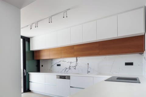 The kitchen is fully equipped with state-of-the-art appliances, ensuring that preparing meals feels like a delightful breeze