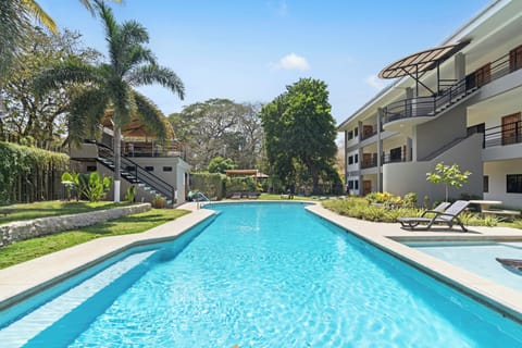 Paradizio is a tranquil oasis just steps from the beach!  Enjoy amenities like a large pool, lounge areas, BBQ pavilion plus gated entry and parking!