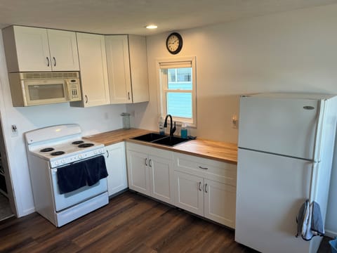 Well equipped kitchen with coffee maker and toaster.