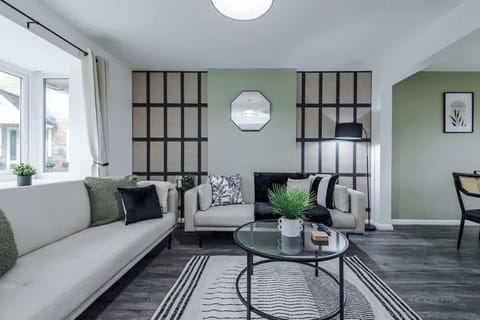 The spacious living space benefits from a 40-inch smart TV and plenty of space to sit down and relax.