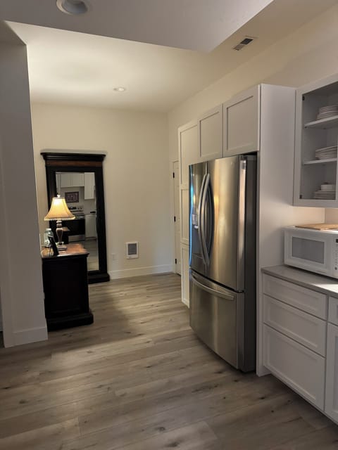 Kitchen and back hall with a full length mirror.