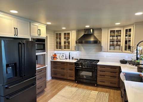 Zline appliances and sink with standard faucet and instant hot water faucet. 