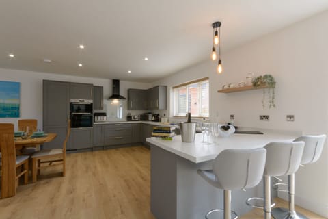 Open plan kitchen, dining and living area, perfect for socialising and enjoying the time together.