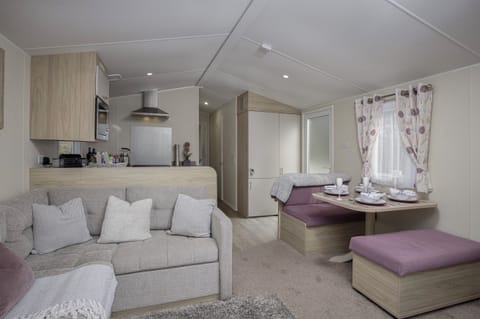 Comfortable open plan kitchen, diner and lounge with stunning views