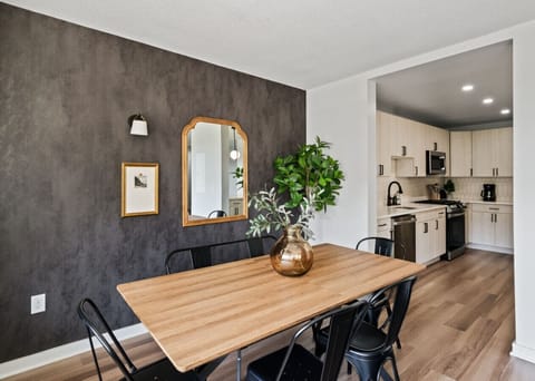 You’ll love gathering around the table in this inviting dining area, perfect for meals, conversations, or working on projects.