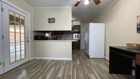 Step into style! ✨ A clean, inviting path leads to a beautifully designed kitchen ready for your culinary adventures. 🍽️